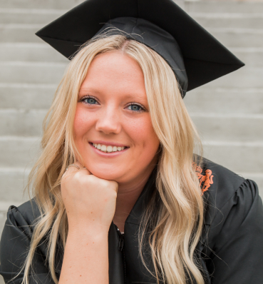 A high school senior posing confidently for a creative and stylish portrait session.